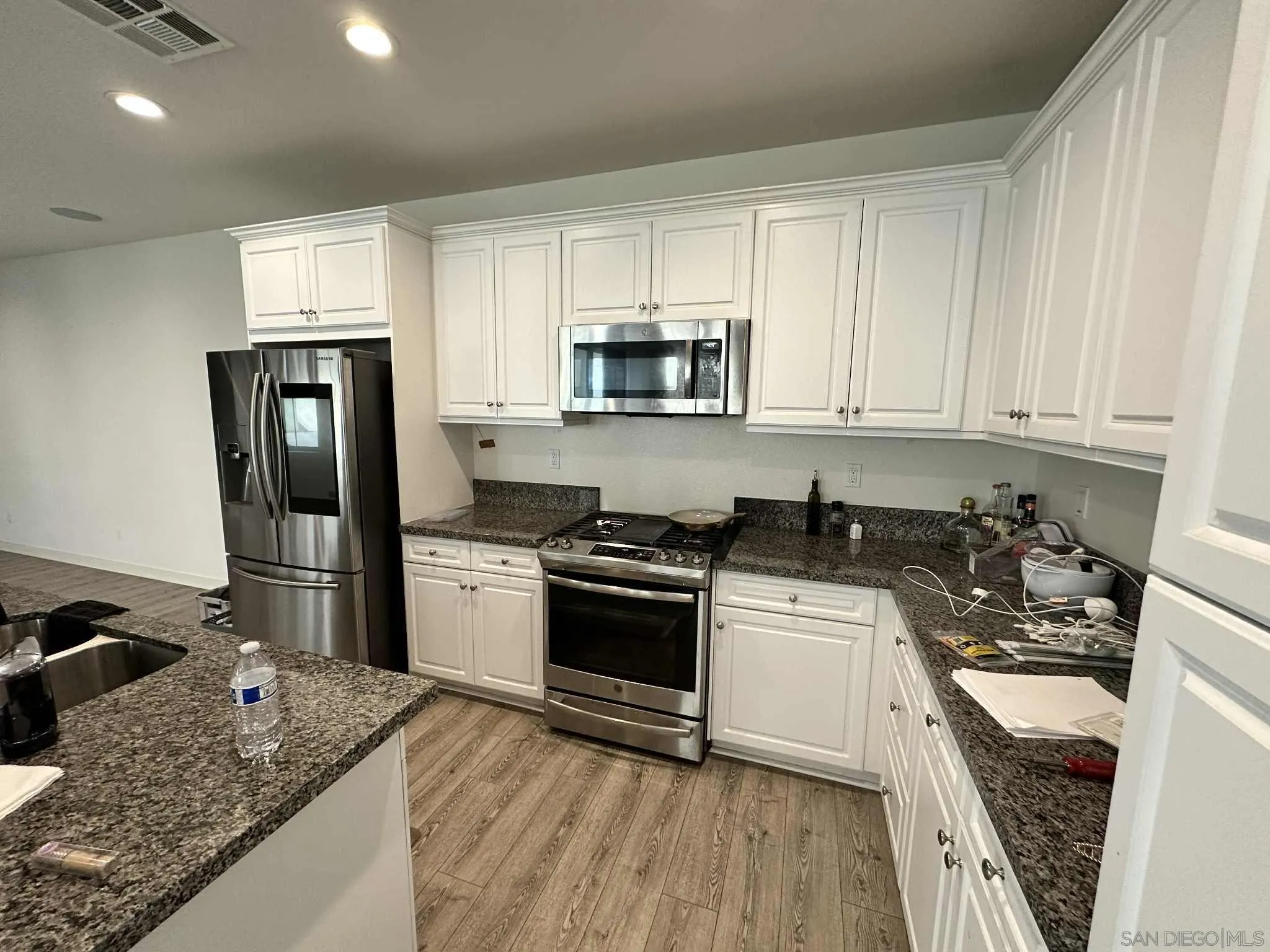 1958 P.º Lugo Chula Vista, CA 91913 - Photo 10 of 68 a kitchen with a sink stove and refrigerator