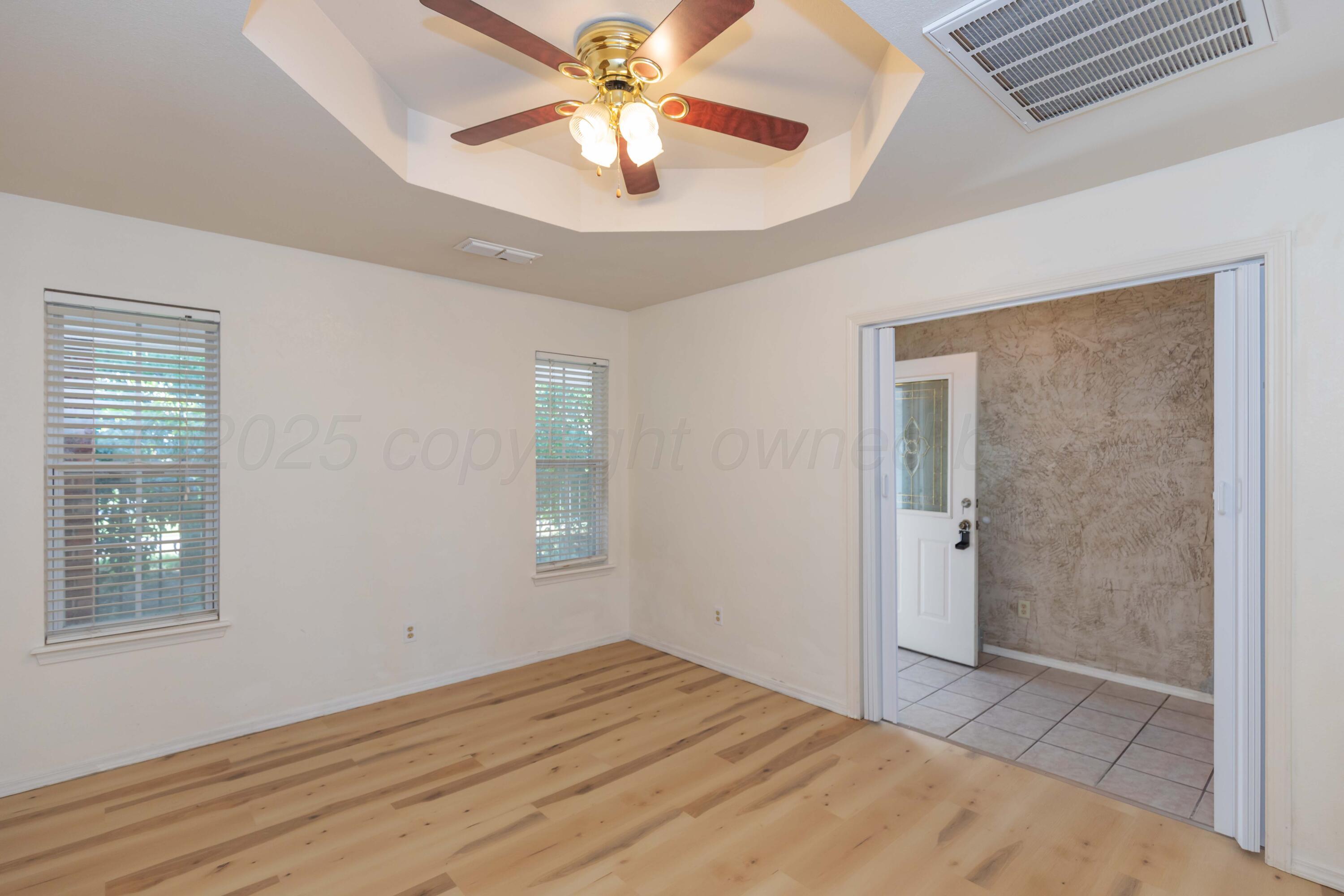 5230 Royce Drive Amarillo, TX 79110 - Photo 16 of 57 a view of empty room with window and ceiling fan