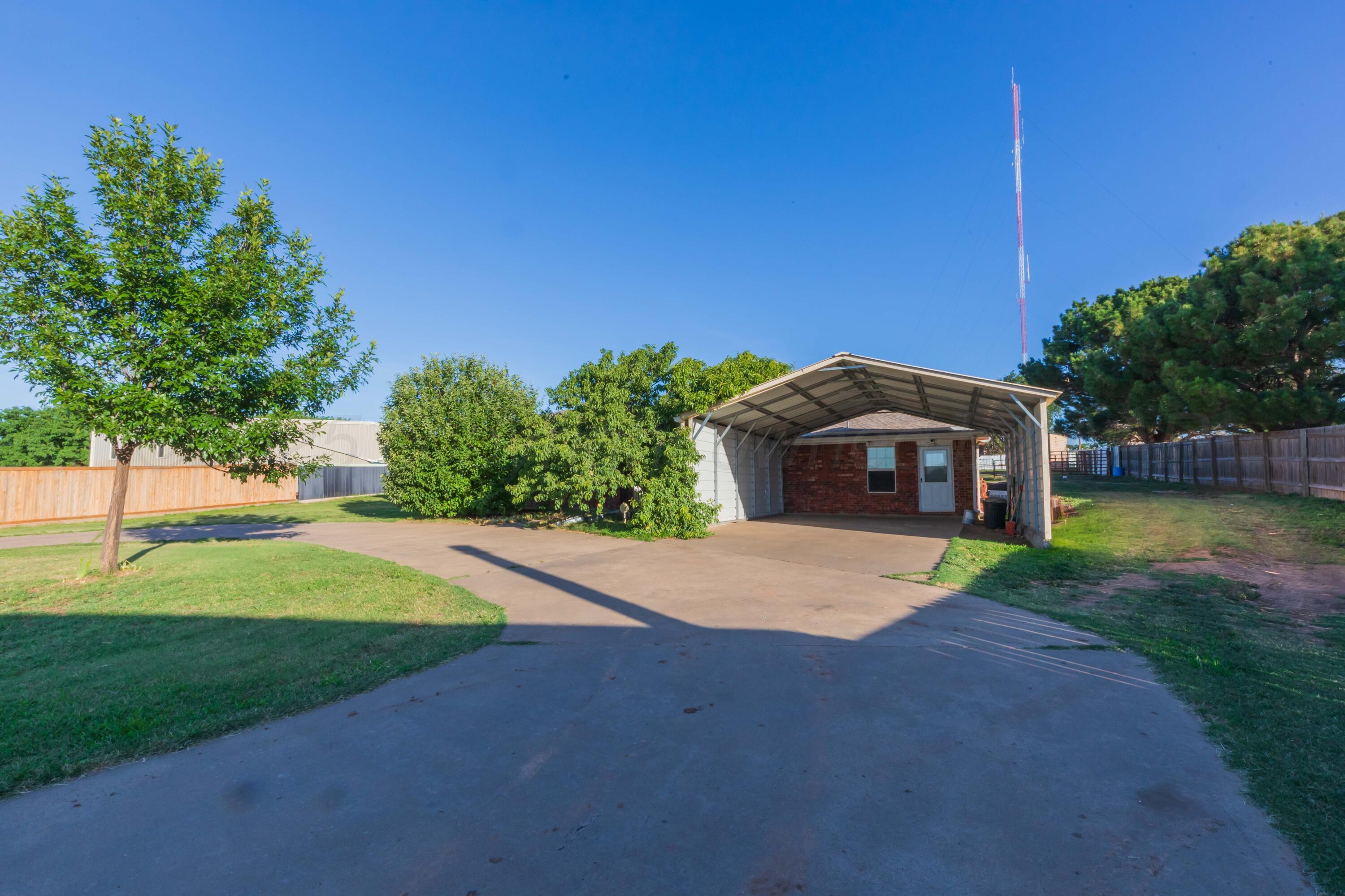 5230 Royce Drive Amarillo, TX 79110 - Photo 2 of 57 a view of a house with a yard and a large tree