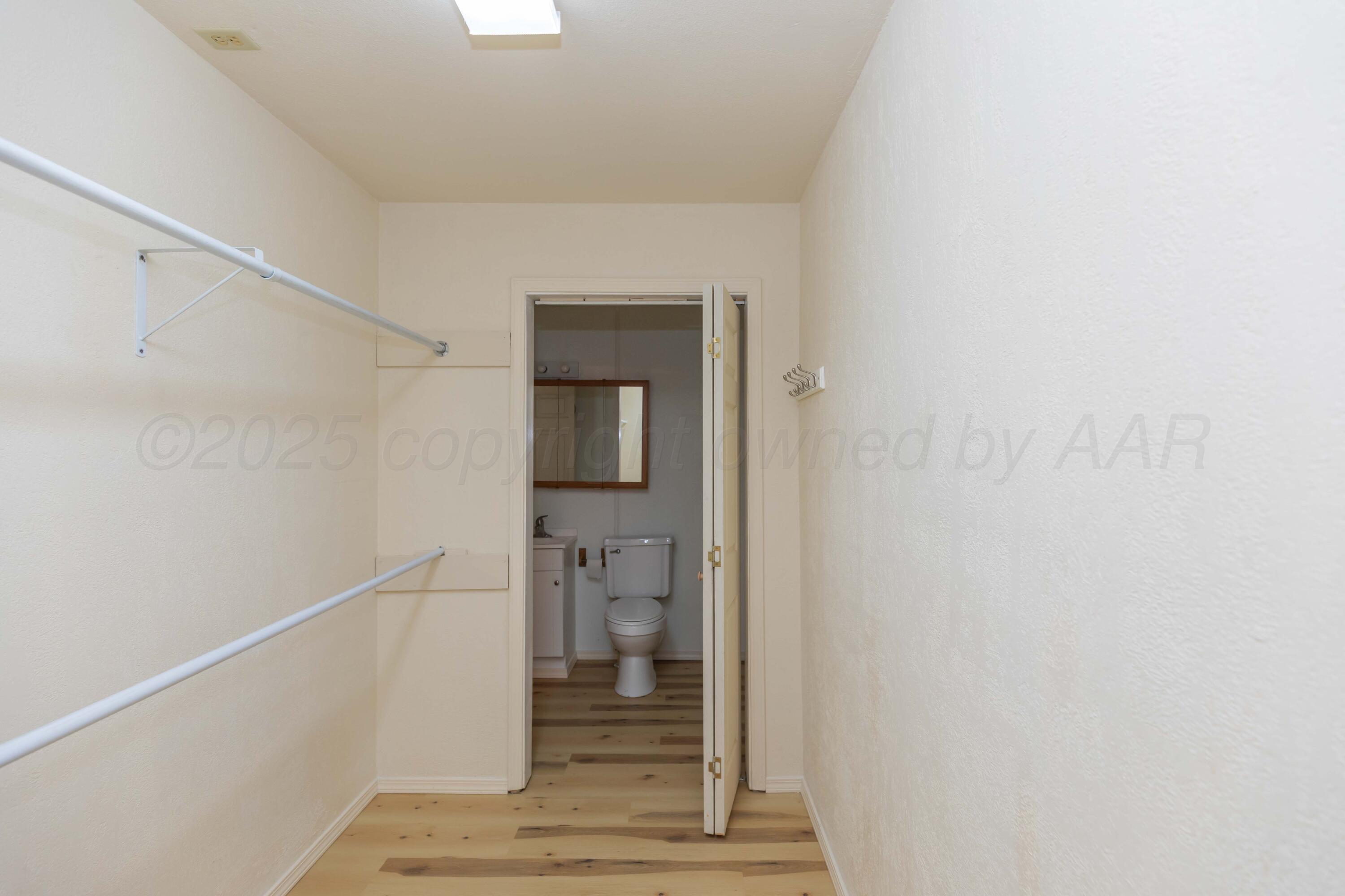 5230 Royce Drive Amarillo, TX 79110 - Photo 23 of 57 a view of a hallway with wooden floor and entryway