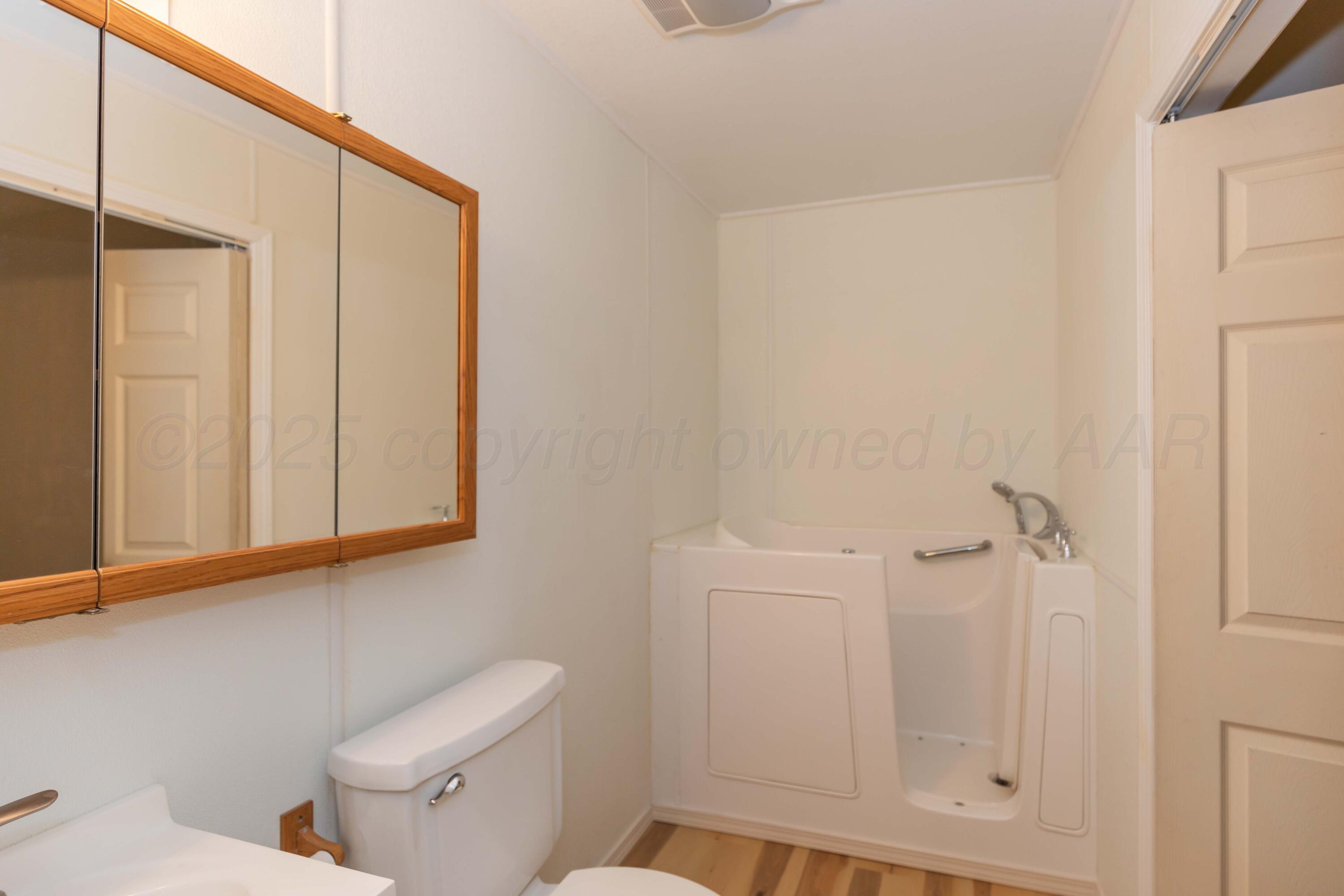 5230 Royce Drive Amarillo, TX 79110 - Photo 26 of 57 a bathroom with a shower a toilet and a sink