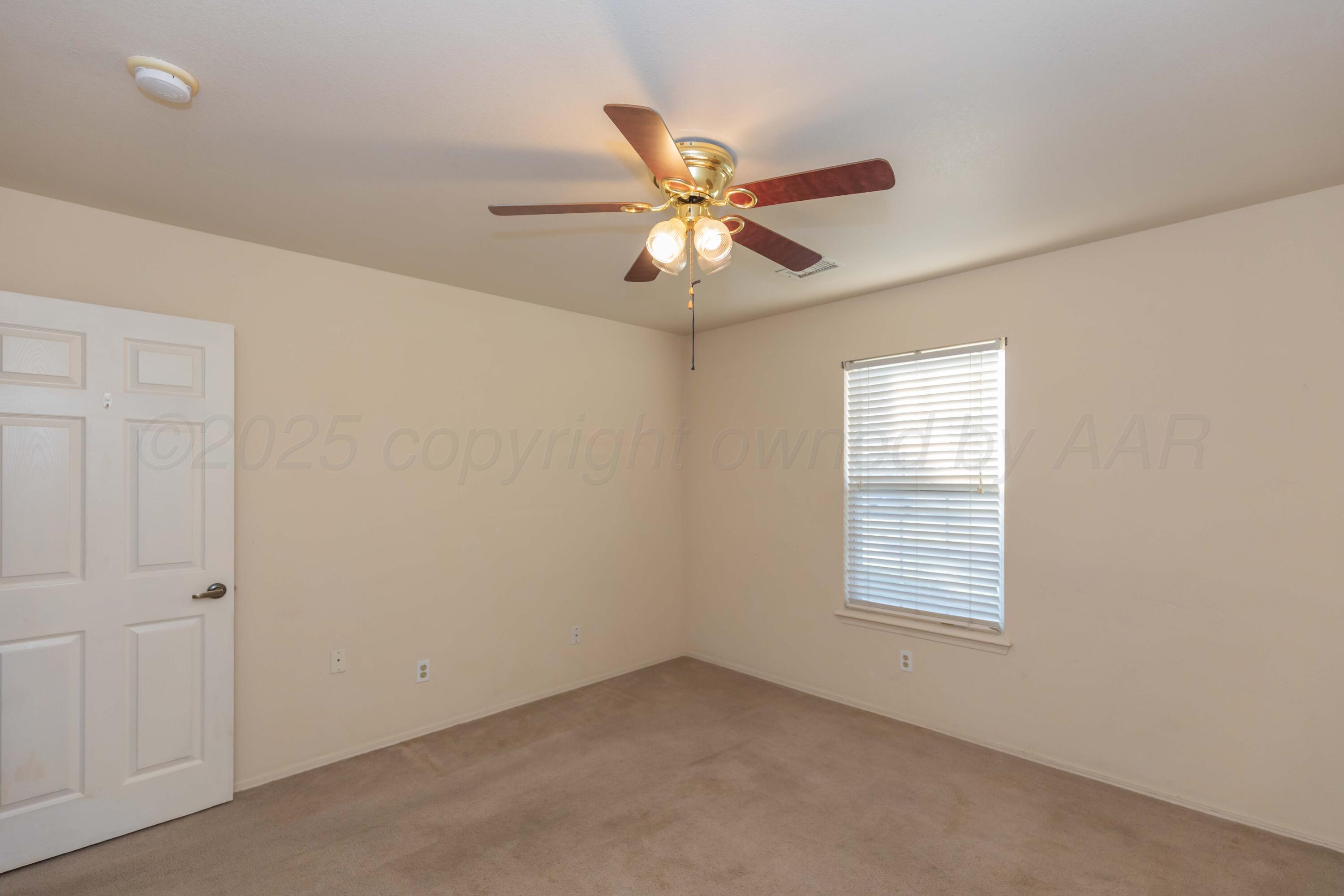 5230 Royce Drive Amarillo, TX 79110 - Photo 39 of 57 a view of an empty room with a window