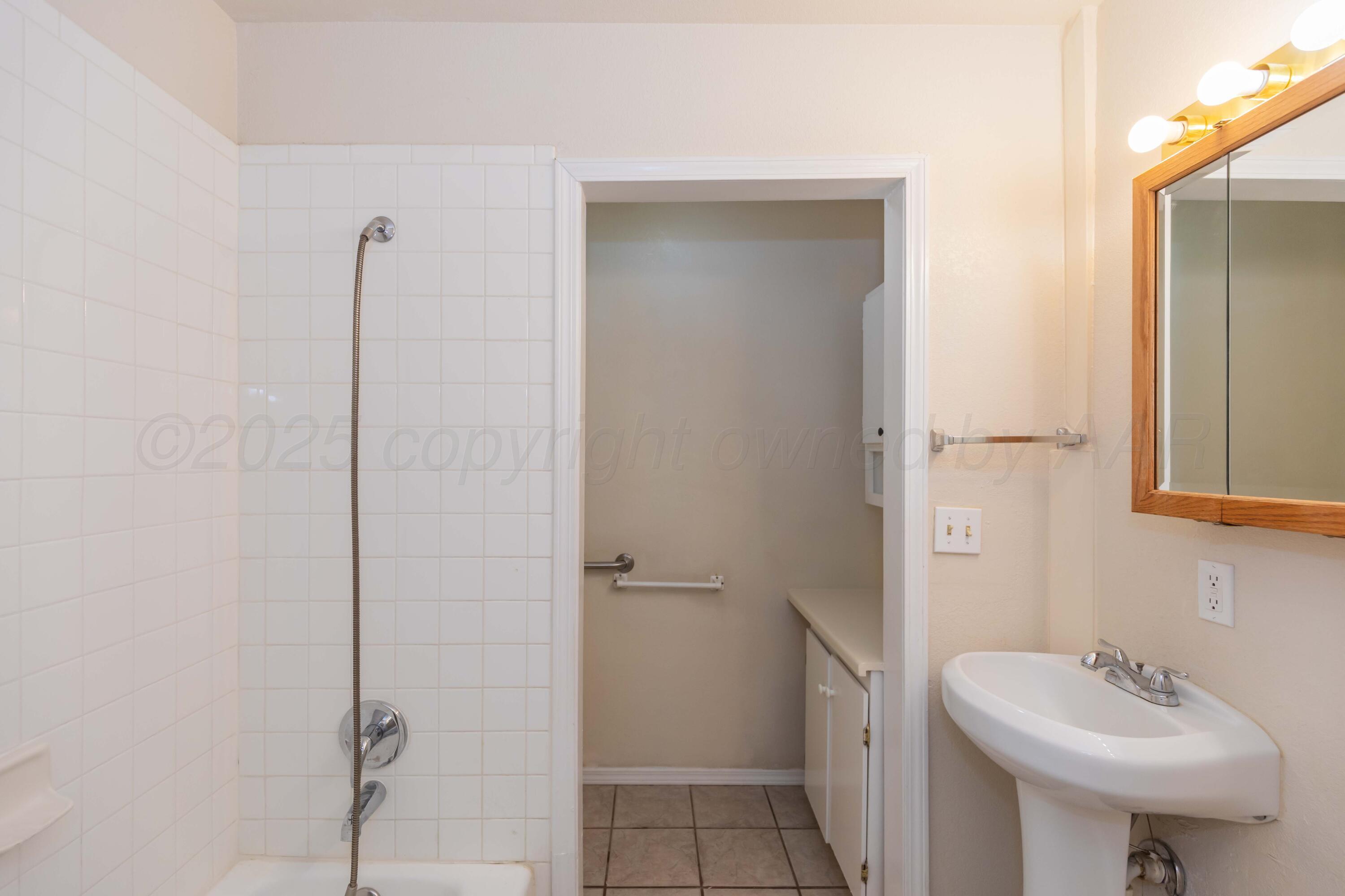 5230 Royce Drive Amarillo, TX 79110 - Photo 40 of 57 a bathroom with a sink a toilet and shower