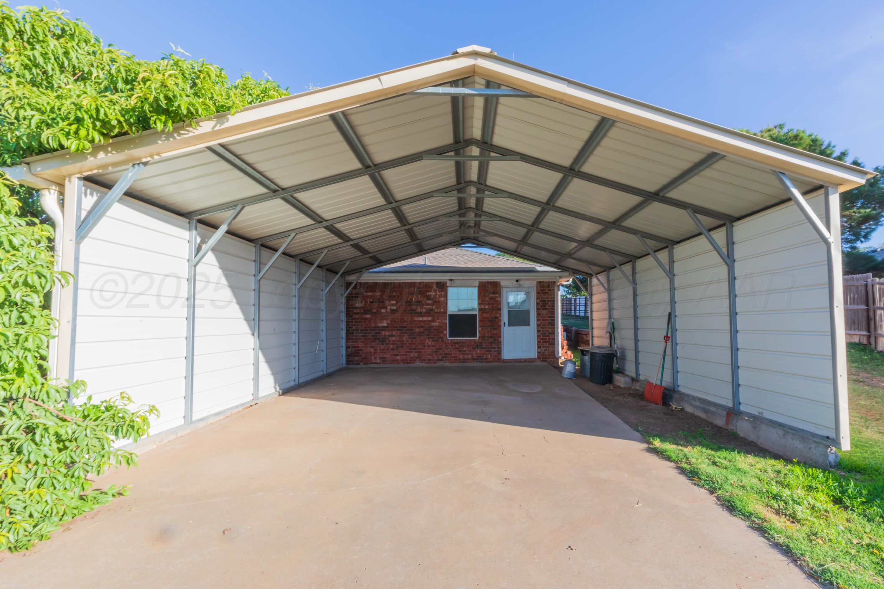 5230 Royce Drive Amarillo, TX 79110 - Photo 54 of 57 a view of a garage with a backyard
