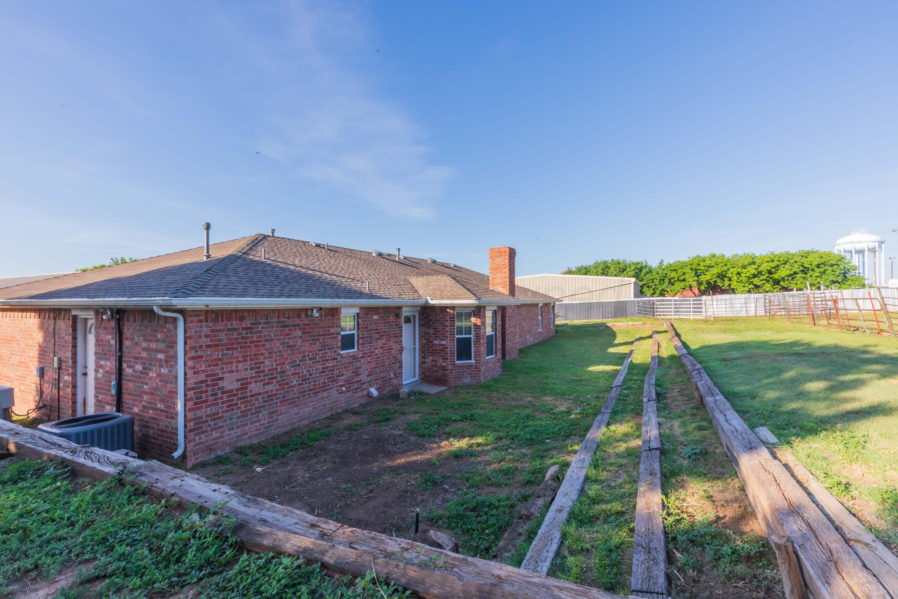 5230 Royce Drive Amarillo, TX 79110 - Photo 56 of 57 a front view of a house with a yard