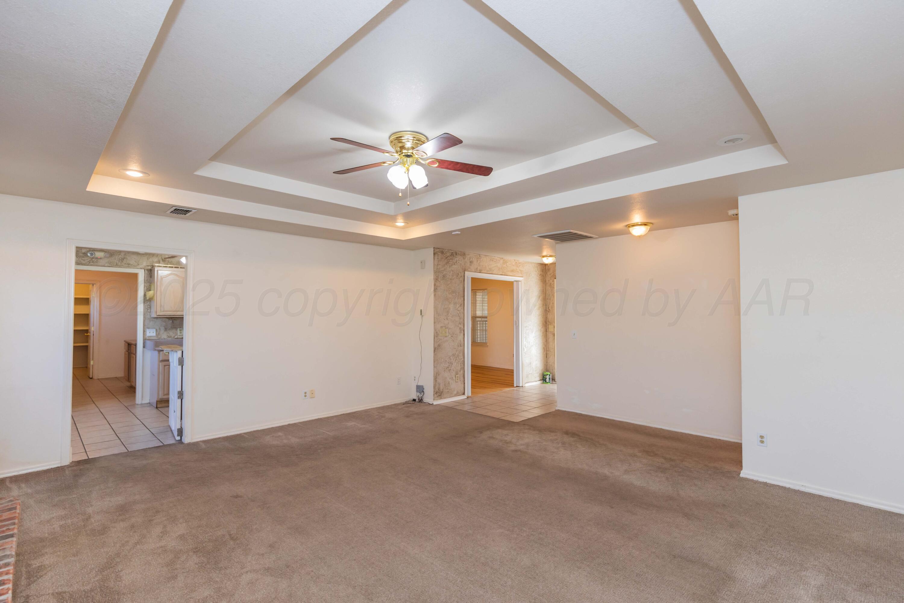 5230 Royce Drive Amarillo, TX 79110 - Photo 6 of 57 a view of an empty room with a window