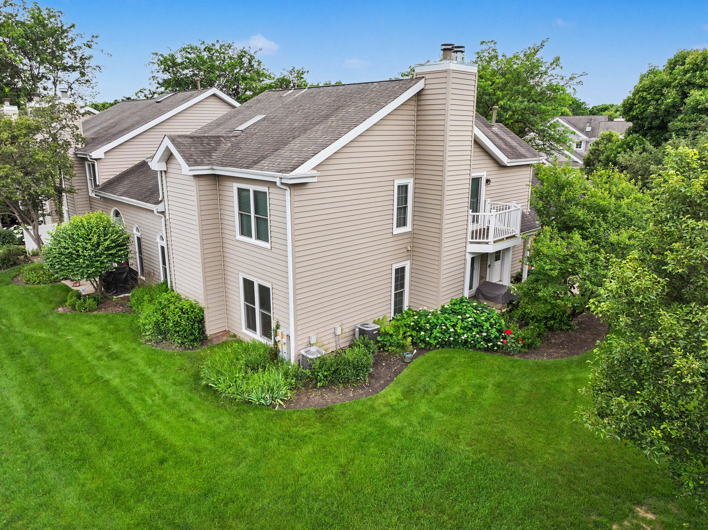 1953 North Coldspring Road Arlington Heights, IL 60004 - Photo 25 of 27 a view of a house with a yard and plants