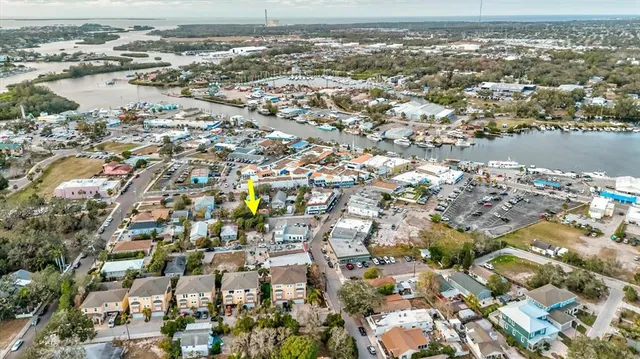 an aerial view of residential houses with outdoor space