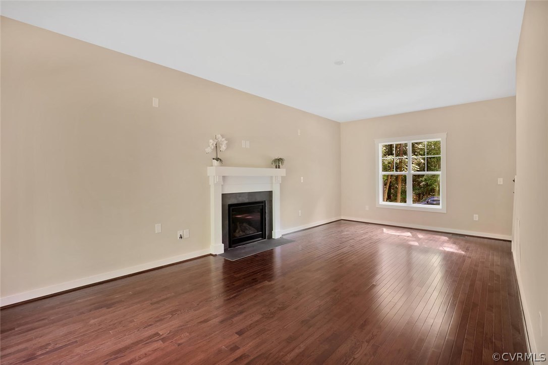 19410 River Road Chesterfield, VA 23838 - Photo 11 of 32 a view of empty room with wooden floor and fireplace