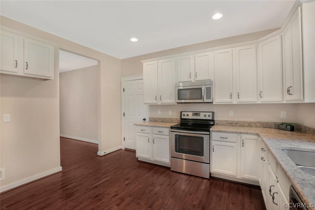 19410 River Road Chesterfield, VA 23838 - Photo 15 of 32 a kitchen with granite countertop white cabinets and stainless steel appliances