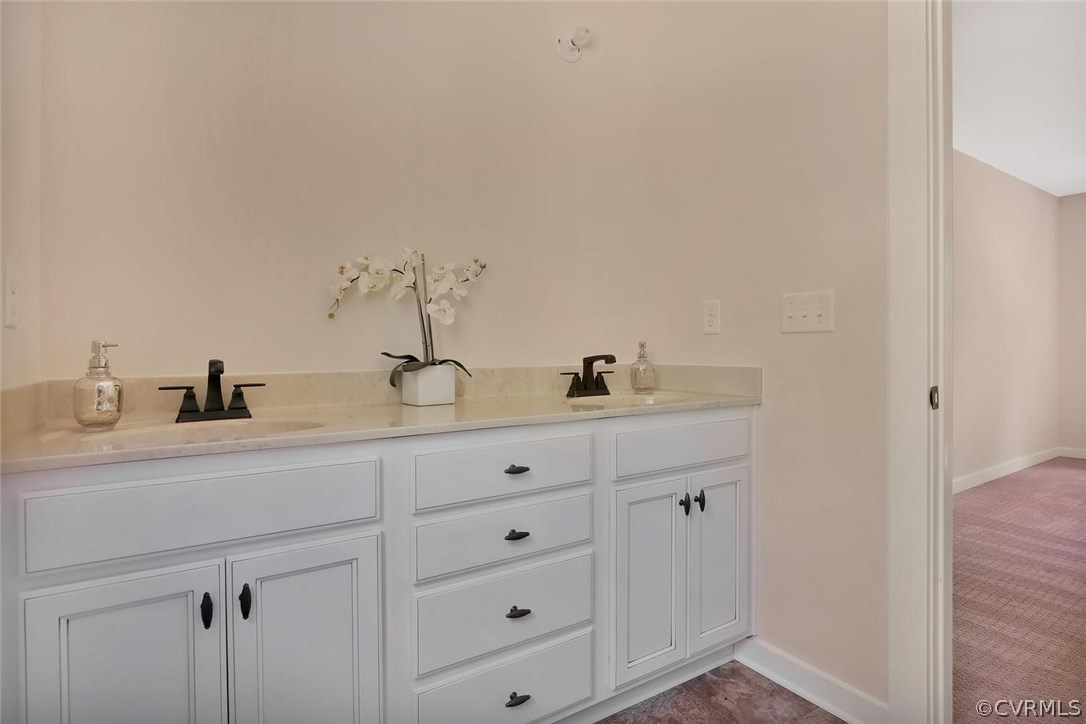 19410 River Road Chesterfield, VA 23838 - Photo 28 of 32 a bathroom with a double vanity sink and mirror