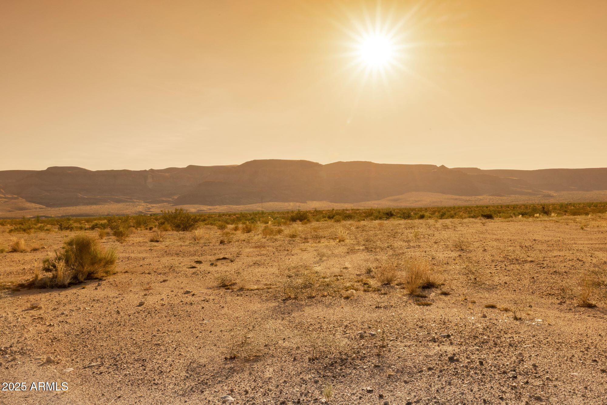 10800 South Double R Drive, Unit 3220832 Yucca, AZ 86438 - Photo 3 of 5 a view of lake and mountain view