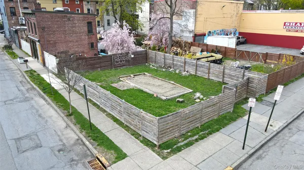 a view of a backyard with sitting area