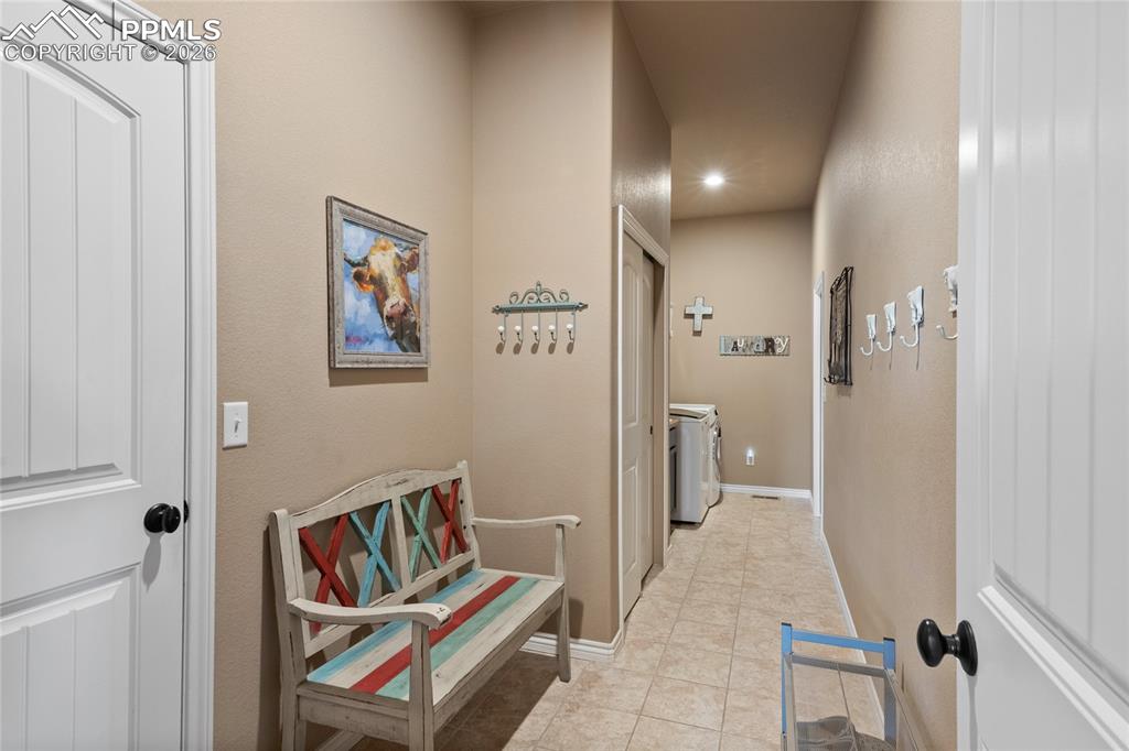3718 Sky Rim Court Colorado Springs, CO 80908 - Photo 29 of 49 Laundry room/mudroom with entryway from the garage. Private from the rest of the home.