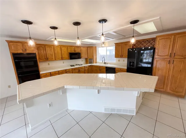 a view of a kitchen with a sink