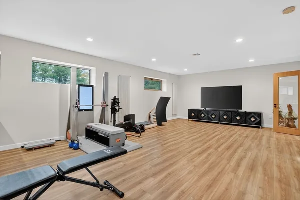 a bedroom with furniture and a flat screen tv