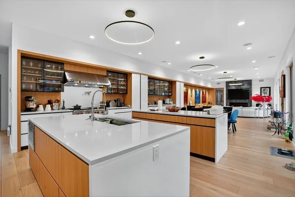 a kitchen with stainless steel appliances granite countertop a sink and a microwave