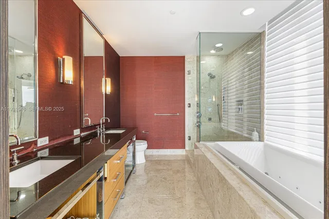 a spacious bathroom with a bathtub sink and mirror
