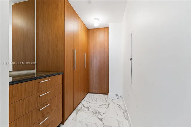 a bathroom with a shower and a sink