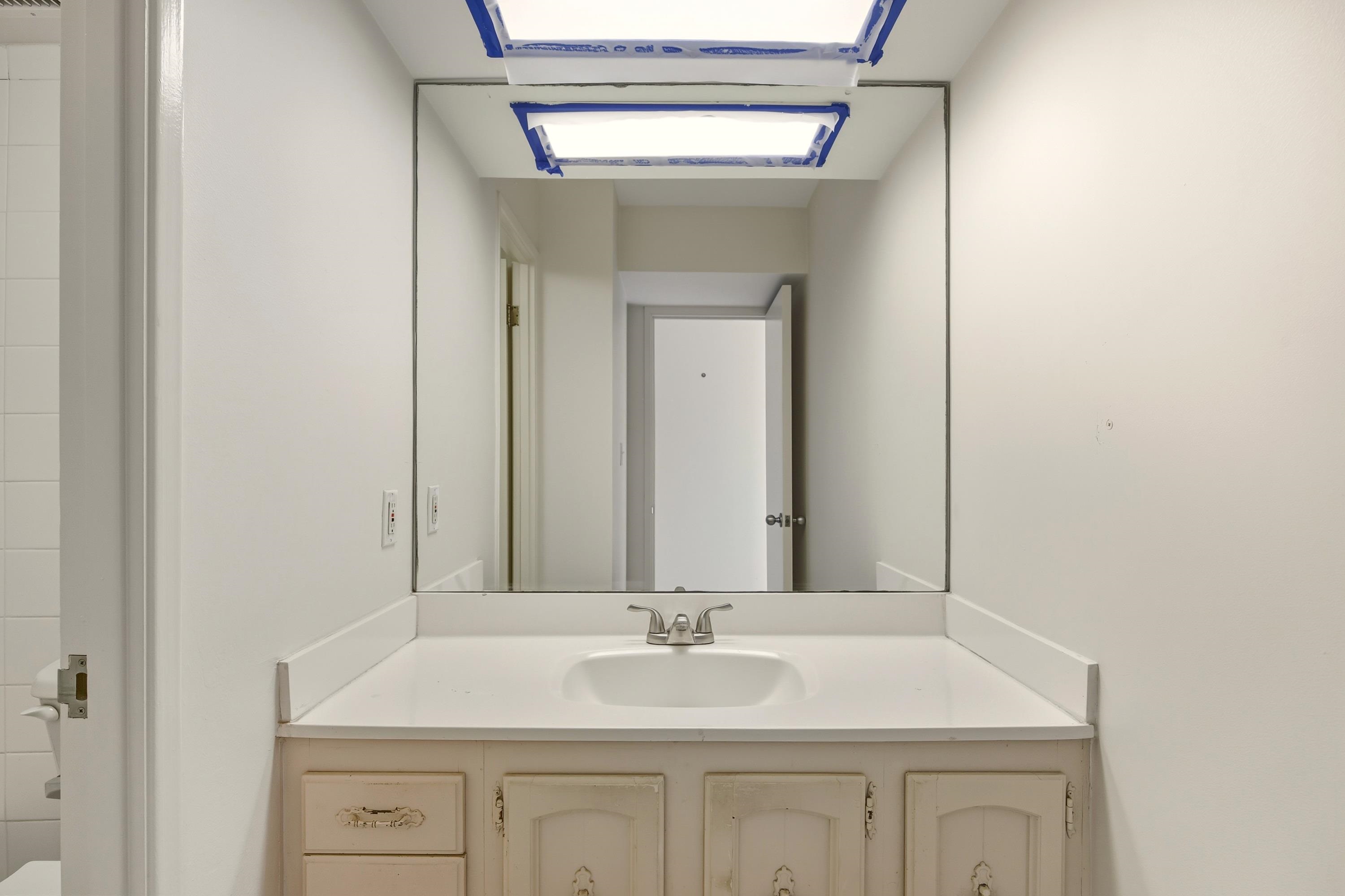 475 Front Street, Unit 334 Lahaina, HI 96761 - Photo 11 of 36 a bathroom with a sink and a mirror