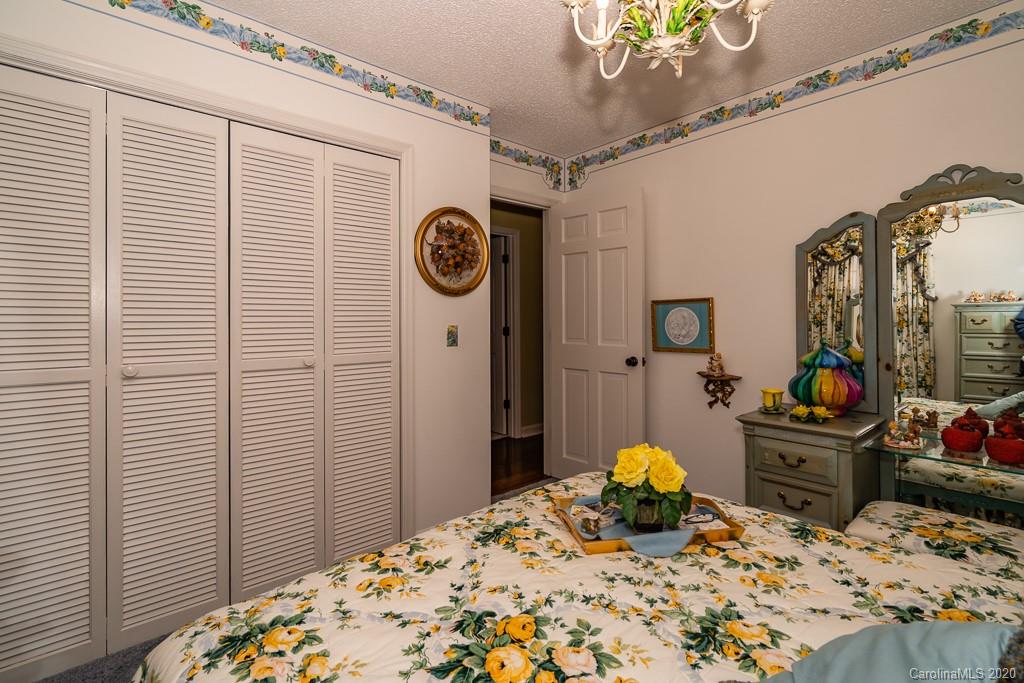 2901 (3 Acres) Screaming Eagle Road Lugoff, SC 29078 - Photo 14 of 48 a bedroom with a bed and a chandelier