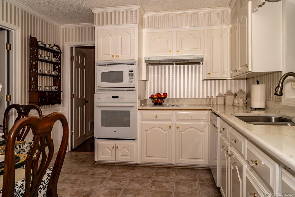 2901 (3 Acres) Screaming Eagle Road Lugoff, SC 29078 - Photo 23 of 48 a kitchen with stainless steel appliances granite countertop a sink stove and cabinets