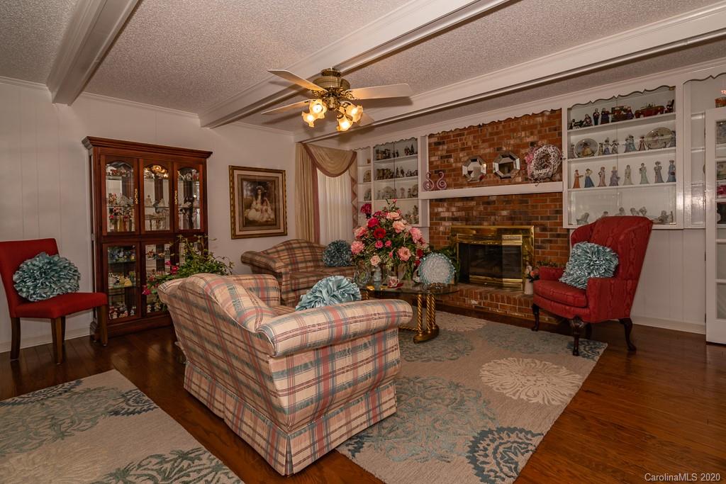 2901 (3 Acres) Screaming Eagle Road Lugoff, SC 29078 - Photo 28 of 48 a living room with furniture a chandelier and a fireplace