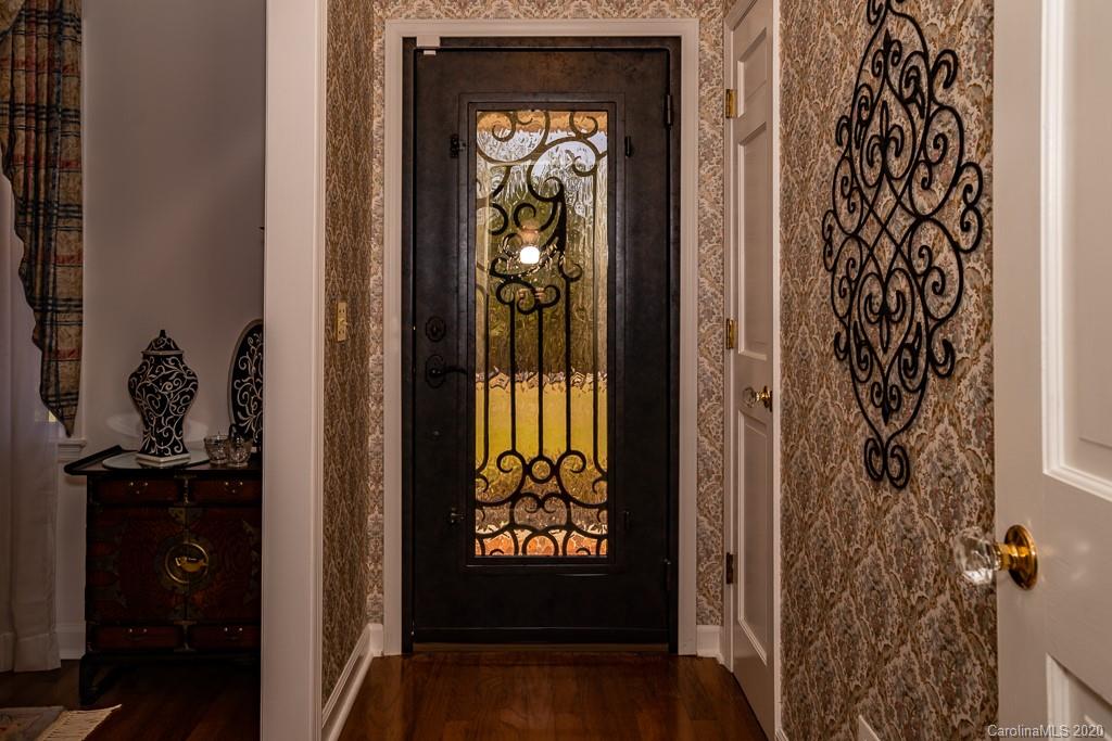 2901 (3 Acres) Screaming Eagle Road Lugoff, SC 29078 - Photo 4 of 48 a view of a hallway with wooden floor and a potted plant