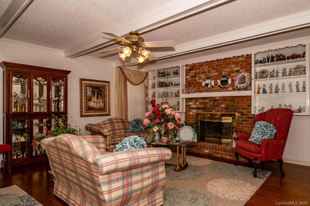 2901 (3 Acres) Screaming Eagle Road Lugoff, SC 29078 - Photo 31 of 48 a living room with furniture a fireplace and a flat screen tv