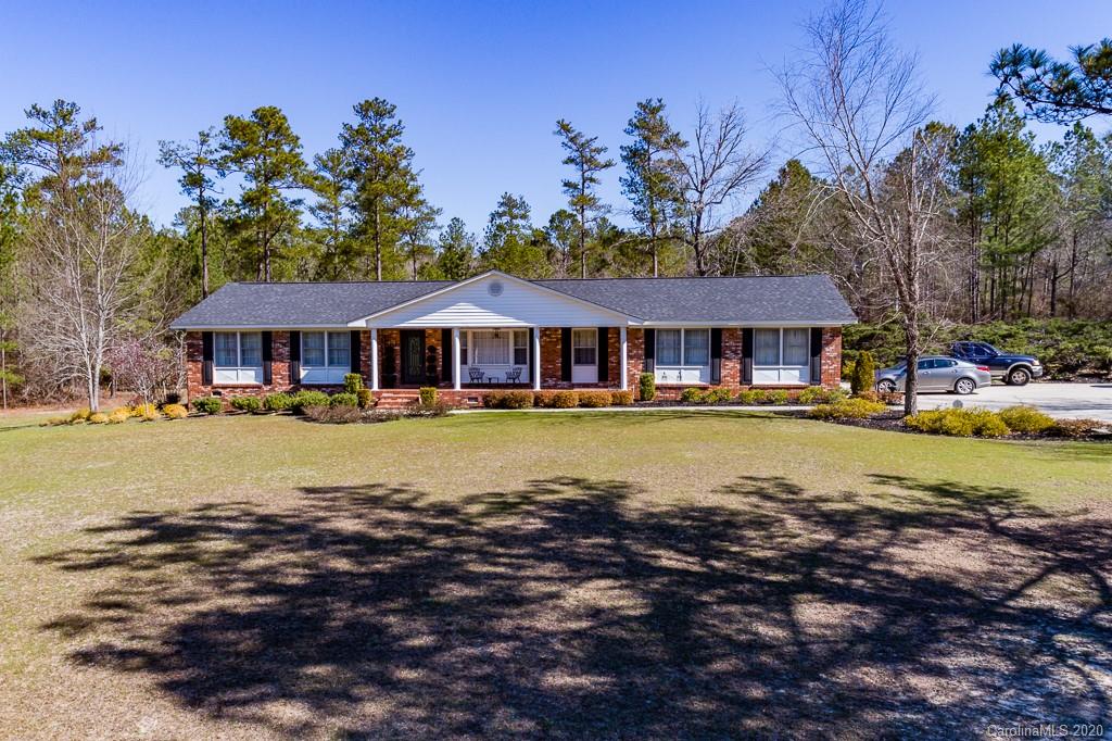 2901 (3 Acres) Screaming Eagle Road Lugoff, SC 29078 - Photo 37 of 48 a view of house with swimming pool yard and outdoor seating