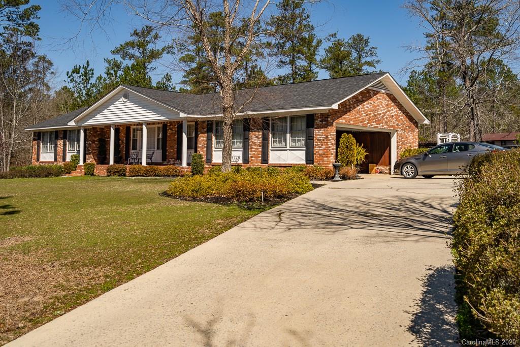 2901 (3 Acres) Screaming Eagle Road Lugoff, SC 29078 - Photo 41 of 48 a front view of a house with a yard and trees