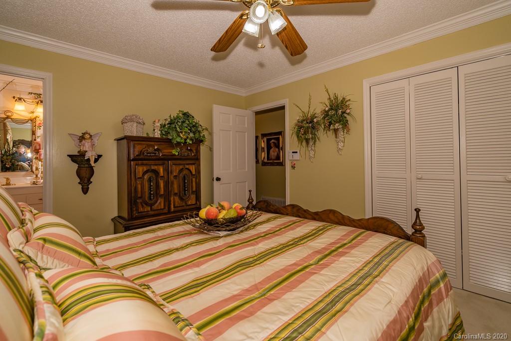 2901 (3 Acres) Screaming Eagle Road Lugoff, SC 29078 - Photo 10 of 48 a bedroom with a bed and ceiling fan