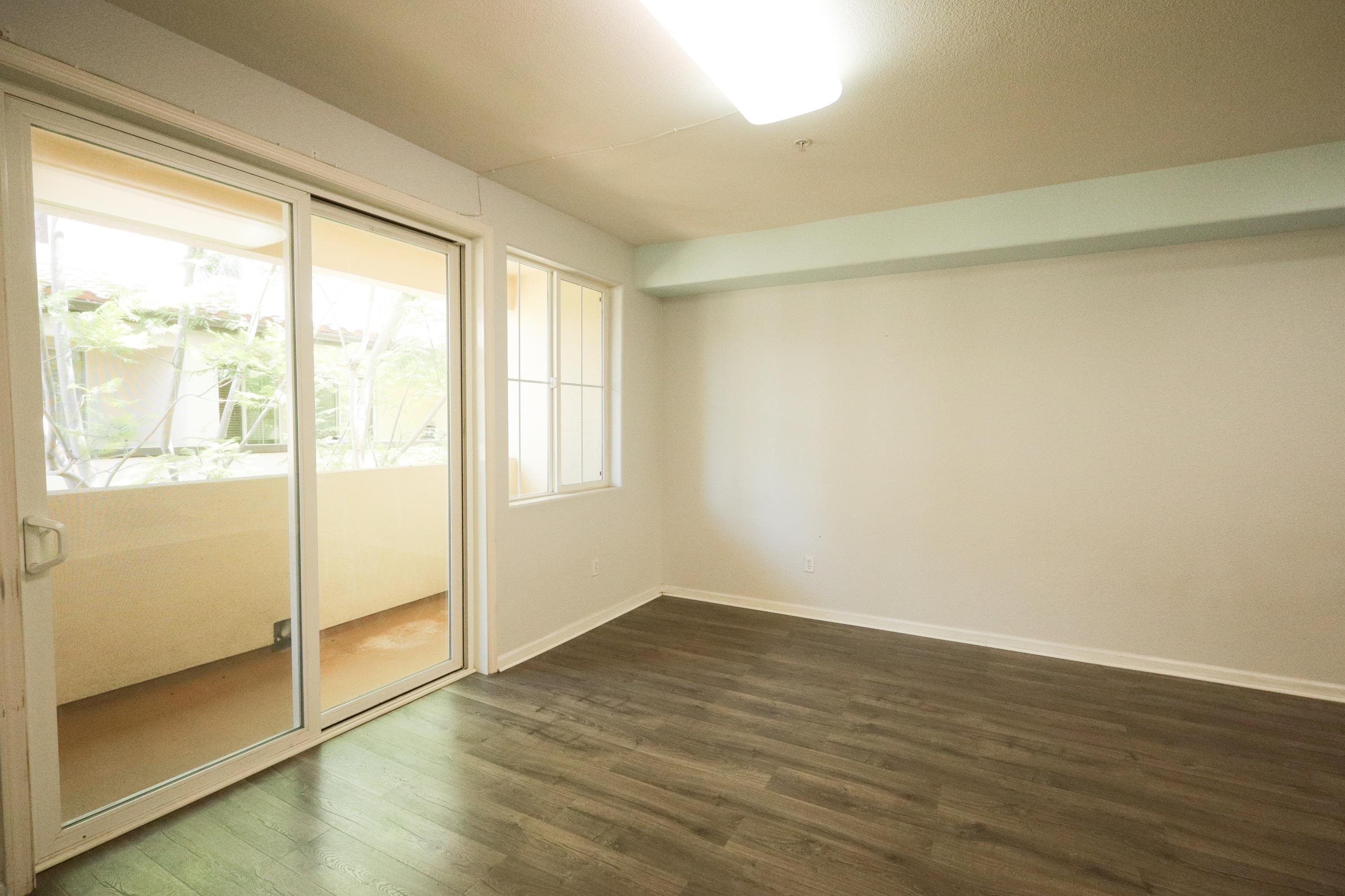 45 Parc Pl Drive Milpitas, CA 95035 - Photo 9 of 9 a view of an empty room with wooden floor and a window