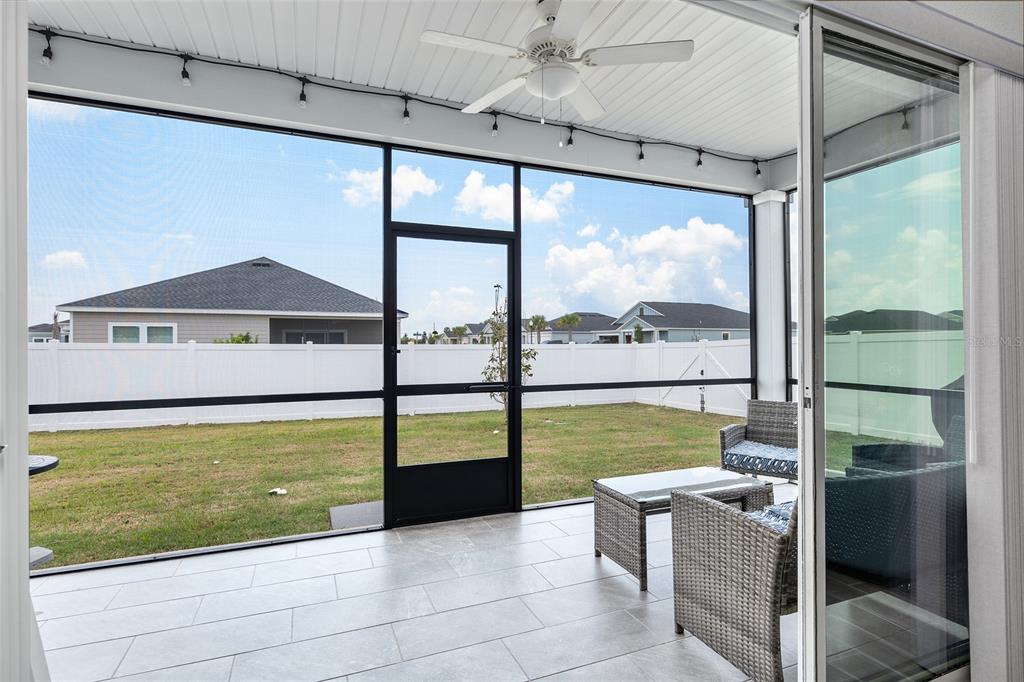 5688 Southwest 92nd Place Ocala, FL 34476 - Photo 44 of 54 a view of a living room and floor to ceiling window