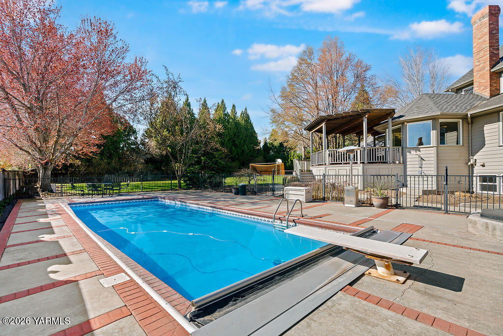 6810 Ravens Gate Way Yakima, WA 98908 - Photo 42 of 49 a view of a swimming pool with lounge chairs in patio