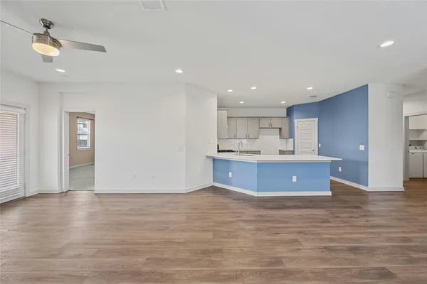 a view of kitchen with wooden floor and window