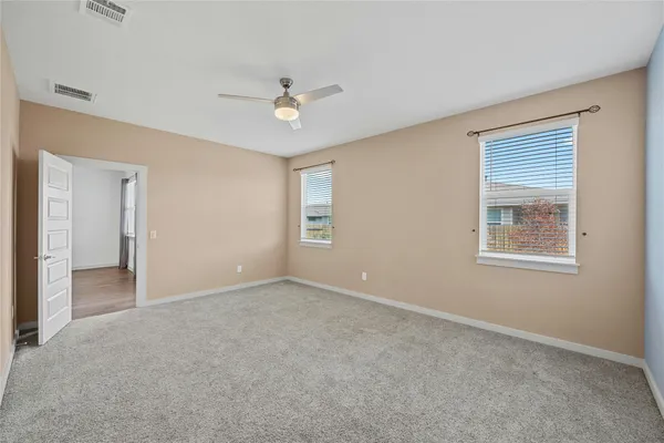 a view of an empty room with a window