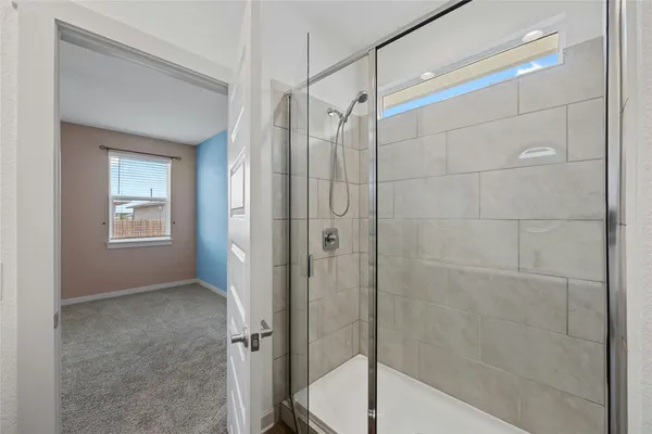 a bathroom with a shower and toilet