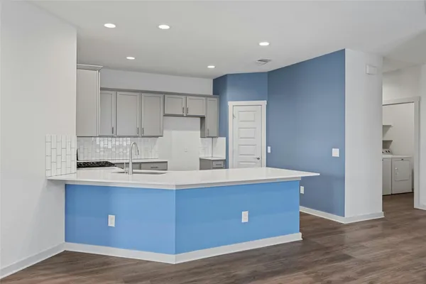 a view of kitchen with wooden floor