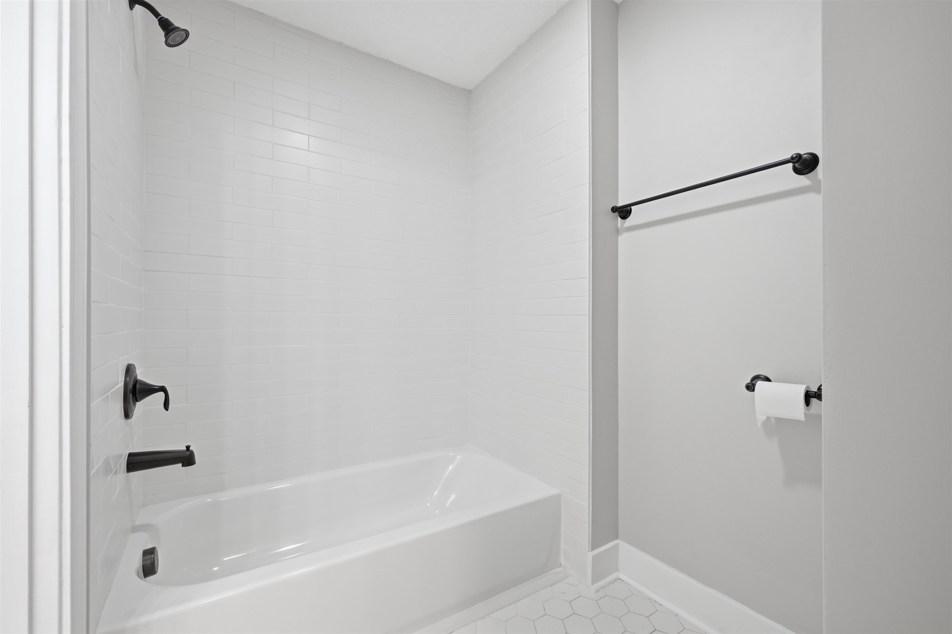 1370 North Reid Hooker Road Eads, TN 38028 - Photo 31 of 39 White subway-tiled shower surround with matte black fixtures