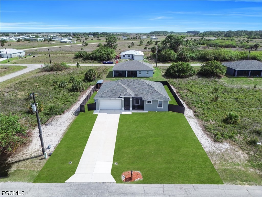 384 Neighborly Road LaBelle, FL 33935 - Photo 44 of 45 an aerial view of a house with a yard