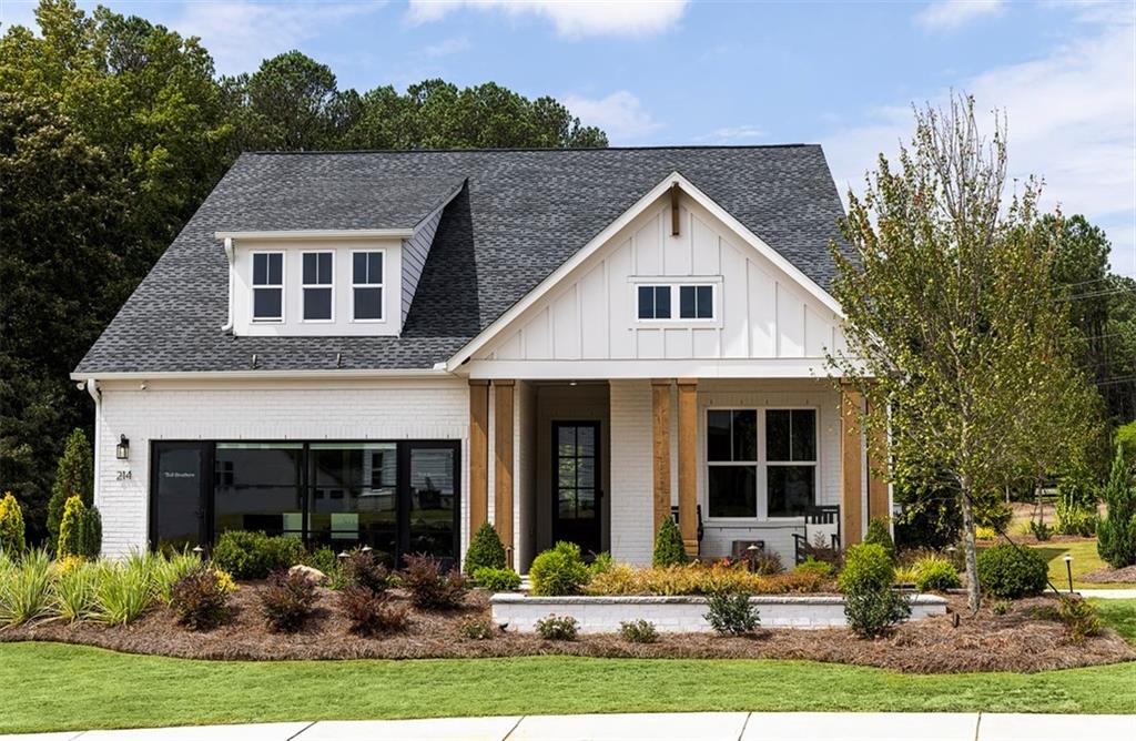 214 Mooney Road Woodstock, GA 30188 - Photo 1 of 17 a front view of a house with garden