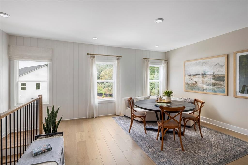 214 Mooney Road Woodstock, GA 30188 - Photo 14 of 17 a view of a dining room with furniture window and wooden floor