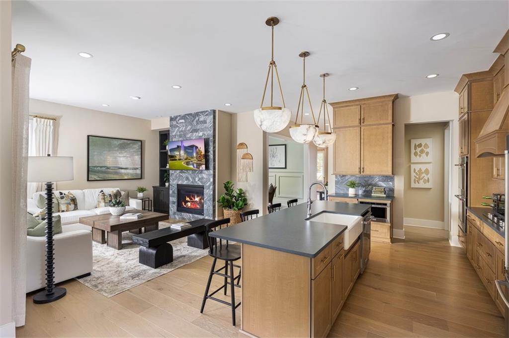 214 Mooney Road Woodstock, GA 30188 - Photo 4 of 17 a very nice looking living room with a large window and a chandelier