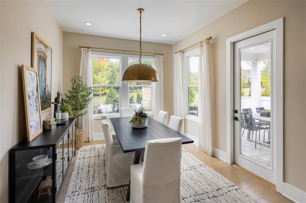 214 Mooney Road Woodstock, GA 30188 - Photo 5 of 17 a view of a dining room with furniture window and wooden floor