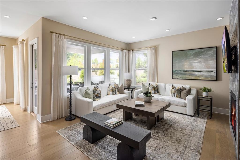 214 Mooney Road Woodstock, GA 30188 - Photo 6 of 17 a living room with furniture and a large window