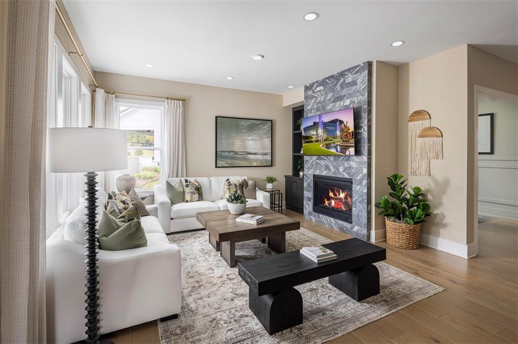214 Mooney Road Woodstock, GA 30188 - Photo 7 of 17 a living room with furniture flower pot and a fireplace