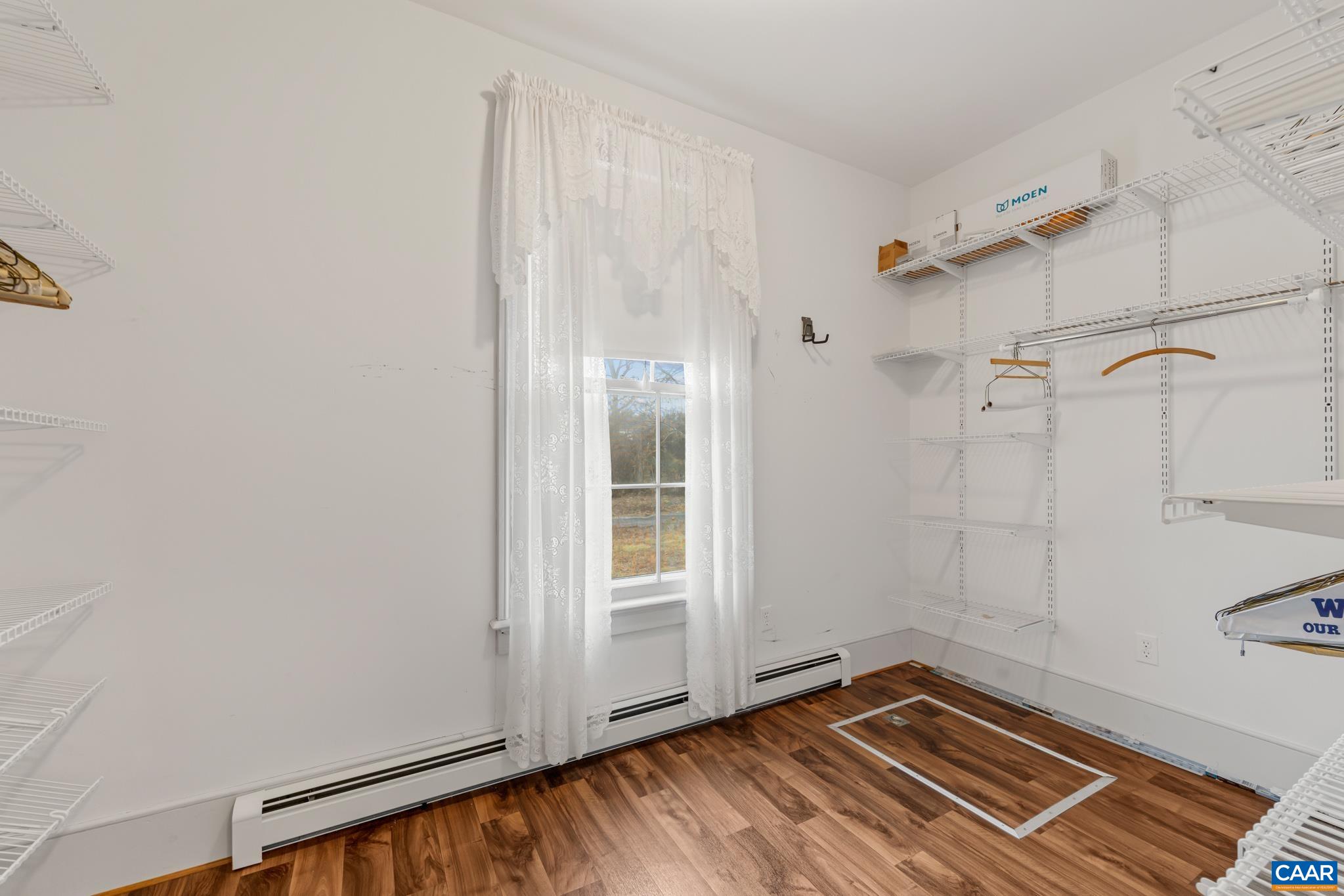 9451 Black Walnut Run Road Rhoadesville, VA 22542 - Photo 34 of 73 a view of a room with wooden floor and white walls