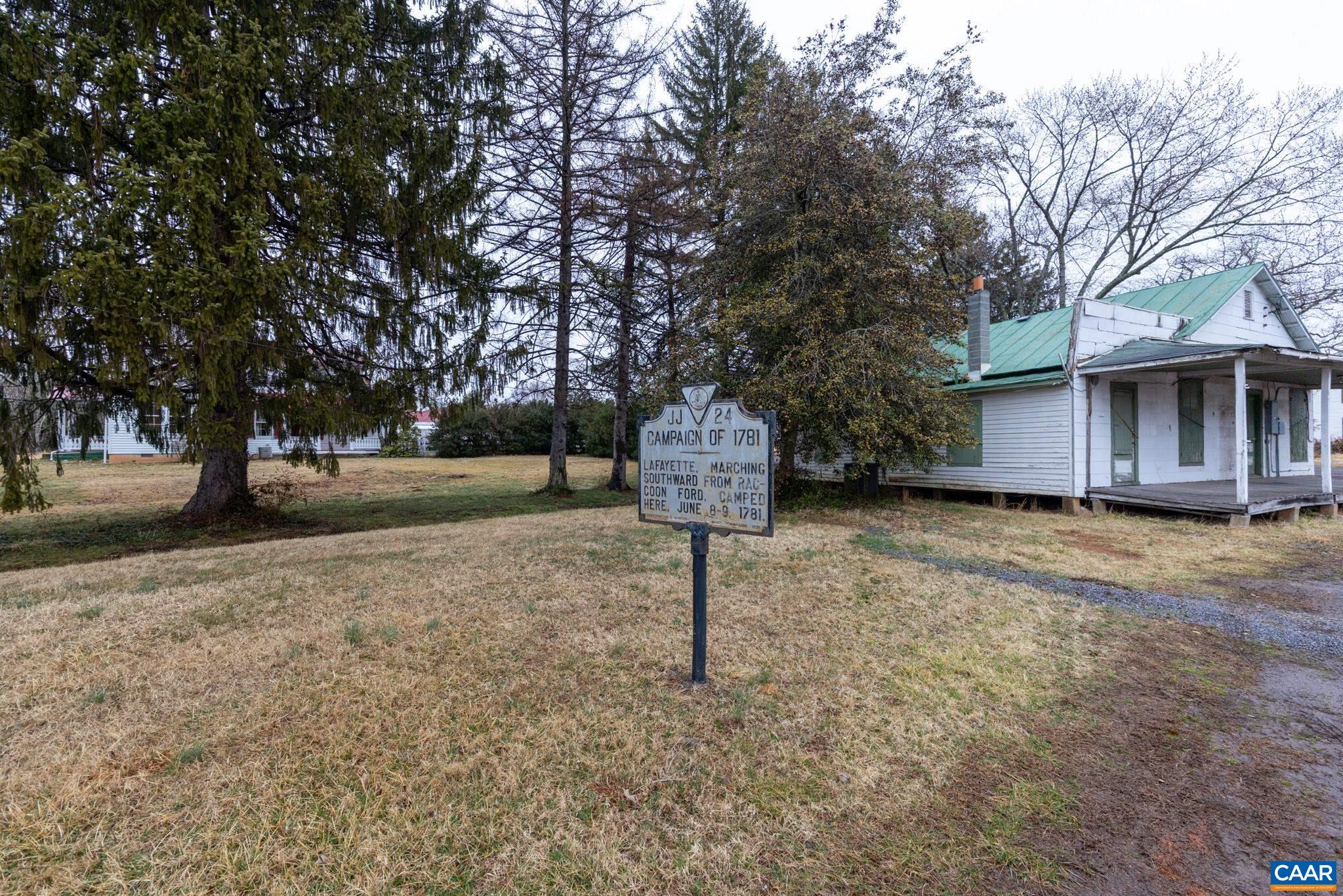 9451 Black Walnut Run Road Rhoadesville, VA 22542 - Photo 69 of 73 a front view of a house with a yard and tree