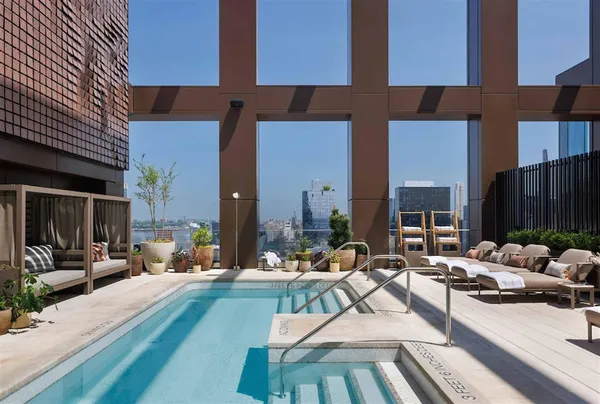 a view of a patio with dining table and chairs with potted plants